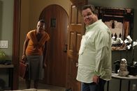 Modern Family – L-R: Adoption Official (Michelle Anne Johnson), Cameron Tucker (Eric Stonestreet)