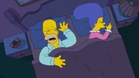 Die Simpsons – Homer (l.); Marge (r.)