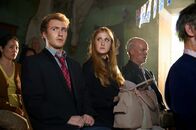Two Heads Creek – Jordan Waller (Norman) and Kathryn Wilder (Annabelle) in the Two Heads Creek town hall for the funeral of thier biological mother Mary.