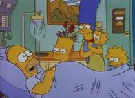 Die Simpsons – Homer wird von Bart, Marge, Maggie und Lisa im Krankenhaus besucht.
