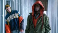 Captive State – Colson Baker (left) as Jurgis and Ashton Sanders (right) as Gabriel in Rupert Wyatt's CAPTIVE STATE, a Focus Features release. Credit: Parrish Lewis / Focus Features; CaptiveState_20170221_Day01of44_0255.arw; Colson Baker (left) as Jurgis and Ashton Sanders (right) as Gabriel in Rupert Wyatt's CAPTIVE STATE.