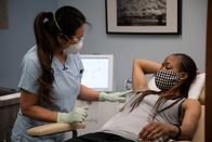 Dr. Pimple Popper – Dr. Lee touches Krista's armpit.