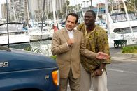 Monk – L-R: Adrian Monk (Tony Shalhoub), Samuel Waingaya (Adewale Akinnuoye-Agbaje )