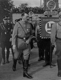 Mythen-Jäger – ca. 1936-1945, Germany --- Adolf Hitler walks among Nazi officers and men at a rally in Germany ca. 1936-1945. --- Image by