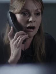 Obsession - Dunkles Verlangen – Michelle (Andrée Bernard) talking on the phone.