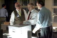 Mayday - Alarm im Cockpit – RE-ENACTMENT STILL: Investigator Caj Frostell (Robert B. Kennedy), left, reviews files with his aides. (Photo Credit: