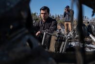 Mayday - Alarm im Cockpit – REENACTMENT - The Main Investigator (played by RJ Parrish) surveys the crash site of US-Bangla Airlines Flight 211, while another investigator documents the wreckage. (Cineflix 2020/Darren Goldstein)