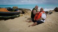 Hawaii Five-0 – On left: Shawn Mokuahi Garnett and on right Taylor Wily (Kamekona).