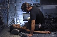 Solaris – SD-963 Chris Kelvin (George Clooney) ponders the shocking appearance of his beloved wife Rheya (Natascha McElhone) aboard a space station. Not for sale or duplication.