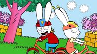 Simon – Im Park haben Simon (l.) und seine Freundin Lou (r.) großen Spaß beim gemeinsamen Fahrradfahren.