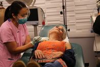 Dr. Pimple Popper – Dr. Sandra Lee performs surgery to remove Juliet's lumps while she holds a mirror.