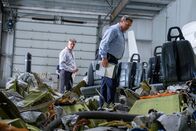 Mayday - Alarm im Cockpit – TSB Investigators Mike Cunningham (played by Judah Katz) and Alan Chaulk (played by Glen McDonald) walk through the remains of Cougar Helicopters Flight 91. (Darren Goldstein/Cineflix 2019)