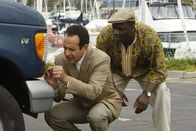 Monk – L-R: Adrian Monk (Tony Shalhoub), Samuel Waingaya (Adewale Akinnuoye-Agbaje )