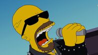 Die Simpsons – Al Atkins, Sänger der Metal-Band "Judas Priest", ist mit seinem Song "Breaking the Law" ein echtes Role Model für Homer Simpson ...