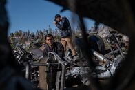 Mayday - Alarm im Cockpit – REENACTMENT - The Main Investigator (played by RJ Parrish) surveys the crash site of US-Bangla Airlines Flight 211, while another investigator documents the wreckage. (Cineflix 2020/Darren Goldstein)