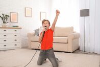 111 – Cute boy singing in microphone at home