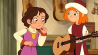 Hexe Lilli – Lilli zeigt Isabelle in Granada die Gitarre.