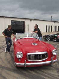 Fast N' Loud – Richard Rawlings and Dennis Collins lean on the Nash Healey.