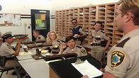 Reno 911! – L-R: Deputy Raineesha Williams (Niecy Nash), Deputy James Garcia (Carlos Alazraqui), Deputy Clementine Johnson (Wendi McLendon-Covey), Deputy Trudy Wiegel (Kerri Kenney), Deputy Travis Junior (Robert Ben Garant), Deputy Cherisha Kimball (Mary Birdsong), Lieutenant Jim Dangle (Thomas Lennon)