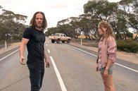 Upright – L-R: Lucky Flynn (Tim Minchin), Meg (Milly Alcock)