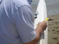 When Sharks Attack - Hai-Alarm – SANTA BARBARA, CALIF. - Ralph Collier examining bite marks on an arm. (National Geographic/Tristan Walker)