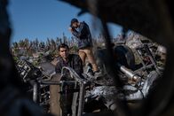 Mayday - Alarm im Cockpit – REENACTMENT - The Main Investigator (played by RJ Parrish) surveys the crash site of US-Bangla Airlines Flight 211, while another investigator documents the wreckage. (Cineflix 2020/Darren Goldstein)
