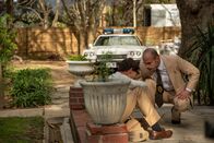 American Monster – Det May (GREG PARVESS), Hargett (ALEX AN-LOS) see Charles (SCOTT GEORGE) covered in blood and distraught.