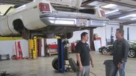 Fast N' Loud – Richard Rawlings and Tom Smith talk next to the elevated 1975 Olds Delta 88.