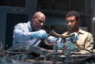 Mayday - Alarm im Cockpit – The Lead Namibian Investigator (played by Jamaal Grant) and Investigator Dennis Jones (played by Glen Michael Grant) work together to analyze pieces of wreckage to find out what happened to LAM Mozambique Flight 470. (Cineflix/Pana Pantazidis)