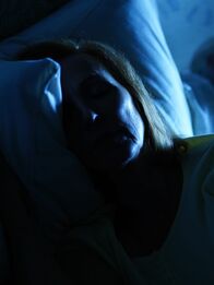 Your Worst Nightmare – A man and woman laying in bed at night.