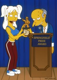 Die Simpsons – Britney Spears (l.) überreicht Mr. Burns (r.) einen Ehrenpreis der Stadt Springfield.