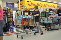 Couponing Extrem – Joyce and her son with full carts.