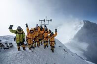 Expedition Everest – At 8,430 meters above sea level, members of the National Geographic and Rolex Perpetual Planet Everest Expedition team celebrate after setting up the world's highest operating automatic weather station. (National Geographic Society/Mark Fisher)