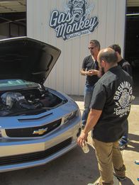 Fast N' Loud – The Gas Monkey mechanics survey the undercarriage of the 2013 COPO Camaro.