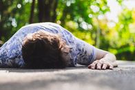 Marktcheck – Old woman having a heart attack fell on the ground. Elder suffering lying on the street with her palm of her hand touching the asphalt