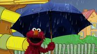 Sesamstraße – Elmo hat Spaß im Regen.