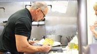 Restaurant Impossible – Robert inspects cauliflower, as seen on Restaurant Impossible.