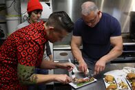 Restaurant Impossible – Crystal and Kiki try the crispy pork.