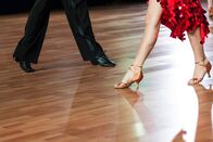 Dancefloor – Closeup of legs of professional dancers performing latin-american program on dancefloor.