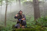 Mayday - Alarm im Cockpit – Lincoln, Ontario - Ony Wibowo (played by Xavier de Guzman) hears a mobile phone ringing amid the debris from the Sukhoi Superject air crash on Mount Salak, Indonesia.
