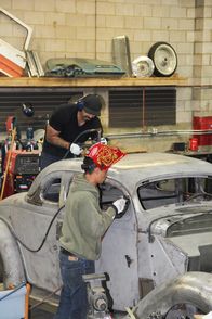 Die Auto-Messies – Abe and Jerome Mena work on the Coupe.