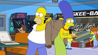 Die Simpsons – Homer (l.); Marge (r.)