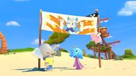 Mamfie – Mamfie, Takolo und Pinkie haben ein Transparent für Käpt'n Kronk am Strand aufgestellt.