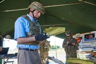 Mayday - Alarm im Cockpit – ONTARIO - RE-ENACTMENT - Investigator (played by Dmitry Chepovetsky) studies a piece of wreckage in the crash site tent.  