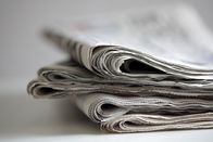 Text Aktuell – Newspapers folded and stacked concept for global communications