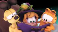 Garfield – Die Freunde lesen im Zauberbuch.