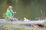 Ein perfekter Mord – A fisherman canoeing in Alligator alley.