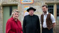 Father Brown – L-R: Mrs McCarthy (Sorcha Cusack), Father Brown (Mark Williams), Sid Carter (Alex Price)