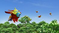 Super Wings – Jett ist als Paradiesvogel verkleidet, um ein gutes Foto zu bekommen.