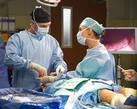 Grey's Anatomy – Richard Flood (Dr. Cormac Hayes), Camilla Luddington (Dr. Jo Karev).